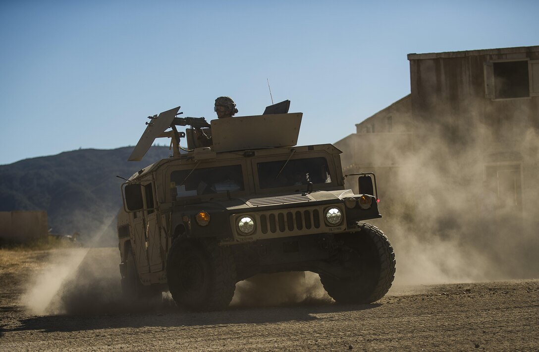 U.S. Army Reserve Soldiers from the 339th Military Police Company (Combat Support), headquartered in Davenport, Iowa, break contact from the enemy during a route reconnaissance at a Warrior Exercise (WAREX) held at Fort Hunter Liggett, California, June 19. The MP company's Soldiers had to relocate their tactical assembly areas in the field multiple times as they reconnoitered different areas of their operational environment, while fighting against temperatures reaching 100-plus degrees daily. (U.S. Army Reserve photo by Master Sgt. Michel Sauret)