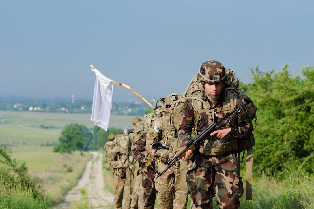 Soldiers assigned to Apache Troop, 4th Squadron, 10th Cavalry Regiment, conduct a spur ride with Hungarian troops in Tata, Hungary, May 31, 2017. Spur rides test soldiers on their reconnaissance and security knowledge, their ability to work as a team and an individual to fight through physical and mental challenges over the course of three days. 24 soldiers completed the spur ride, including 5 Hungarians, and earned the right to wear the cavalry's silver spurs. Army photo by Capt. John W. Strickland