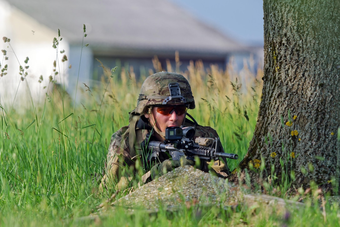 A soldier assigned to Apache Troop, 4th Squadron, 10th Cavalry Regiment, provides security during a spur ride in Tata, Hungary,  June 1, 2017. Army photo by Capt. John W. Strickland