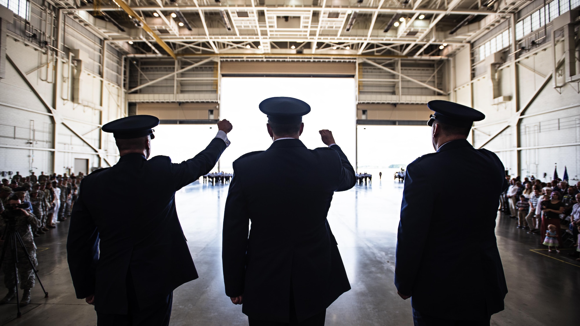 Col. Frederick D. Thaden, Maj. Gen. Christopher Bence and Col. Neil Richardson, sing the Air Force Song following the Joint Base McGuire-Dix-Lakehurst and 87th Air Base Wing change of command ceremony held June 19, 2017 at Joint Base MDL, N.J. Bence, U.S. Air Force Expeditionary Center commander officiated the ceremony in which Richardson assumed command of the unit from Thaden. (U.S. Air Force photo by Staff Sgt. Katherine Spessa)