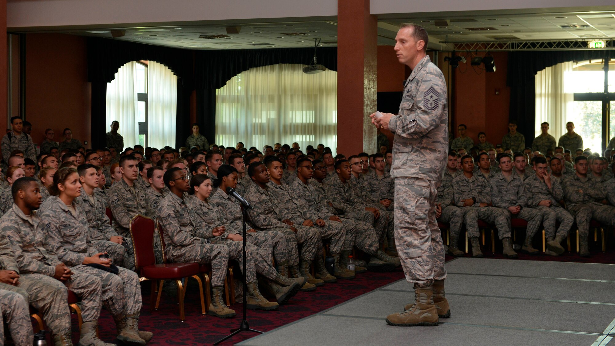 Chief Master Sgt. Matthew Lusson, 31st Fighter Wing command chief, talks with Airmen about family, training your replacements and having fun, during an enlisted call, June 14, 2017, at Aviano Air Base, Italy. To Lusson, these three principles are key to a successful military career. (U.S. Air Force photo by Senior Airman Cary Smith)
