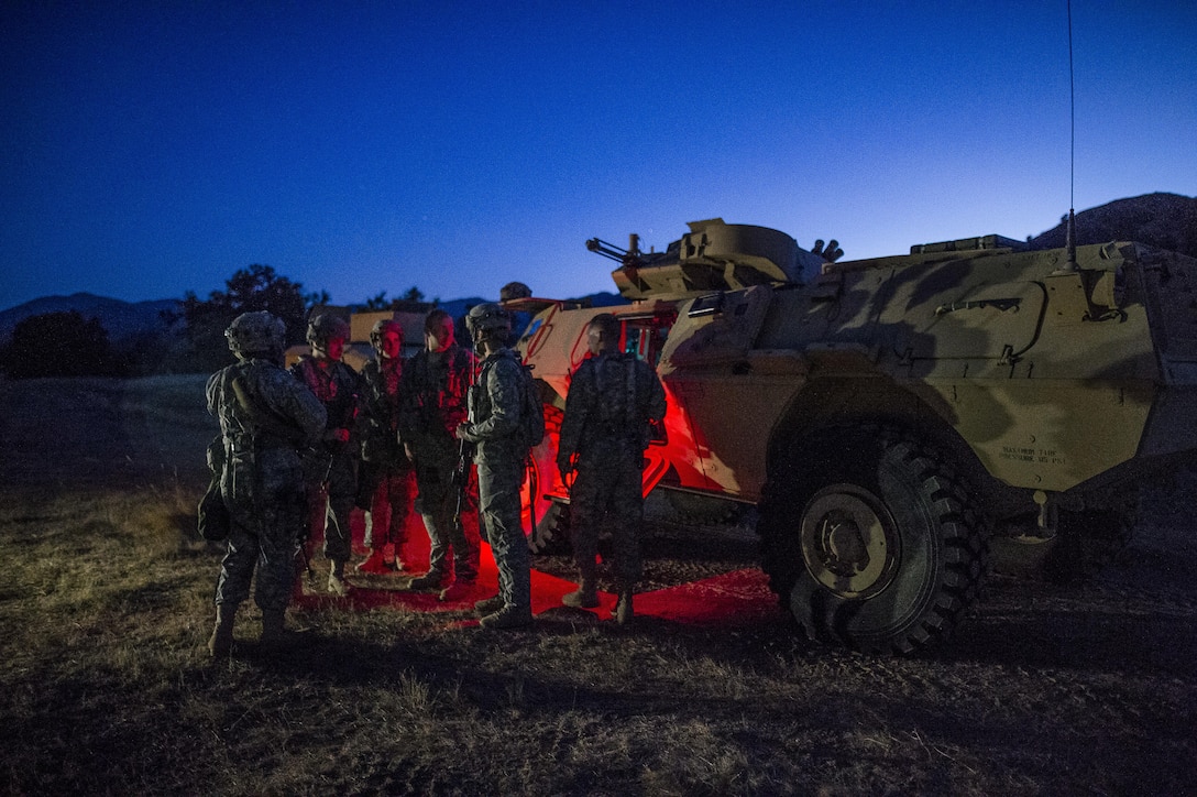 U.S. Army Reserve Soldiers from the 339th Military Police Company (Combat Support), headquartered in Davenport, Iowa, prepare for a route reconnaissance during a Warrior Exercise (WAREX) held at Fort Hunter Liggett, California, June 20. The MP company's Soldiers had to relocate their tactical assembly areas in the field multiple times as they reconnoitered different areas of their operational environment, while fighting against temperatures reaching 100-plus degrees daily. (U.S. Army Reserve photo by Master Sgt. Michel Sauret)