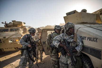 U.S. Army Reserve military police Soldiers from the 339th Military Police Company (Combat Support), headquartered in Davenport, Iowa, help evacuate an "injured" Soldier during a route reconnaissance at a Warrior Exercise (WAREX) held at Fort Hunter Liggett, California, June 20. The MP company's Soldiers had to relocate their tactical assembly areas in the field multiple times as they reconnoitered different areas of their operational environment, while fighting against temperatures reaching 100-plus degrees daily. (U.S. Army Reserve photo by Master Sgt. Michel Sauret)