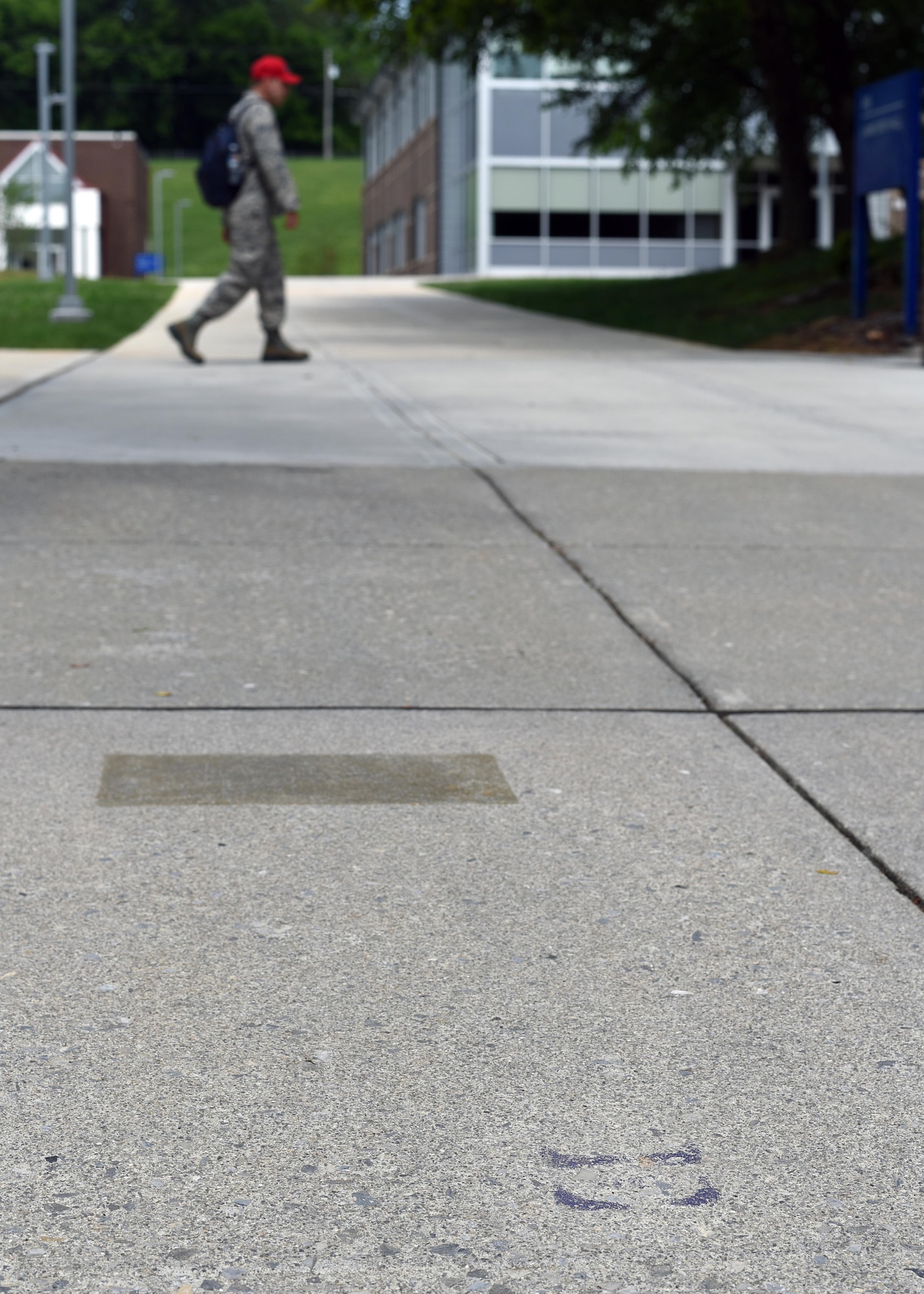 Faded gold-painted bars and purple letters were sidewalk markers that the Air National Guard’s Academy of Military Science officer candidates once used for daily formations at the I.G. Brown Training and Education Center in East Tennessee. AMS commissioned more than 14,600 officers in the six-week program between 1971 and 2009 before moving to Maxwell Air Force Base in Alabama. (U.S. Air National Guard photo by Master Sgt. Mike R. Smith)