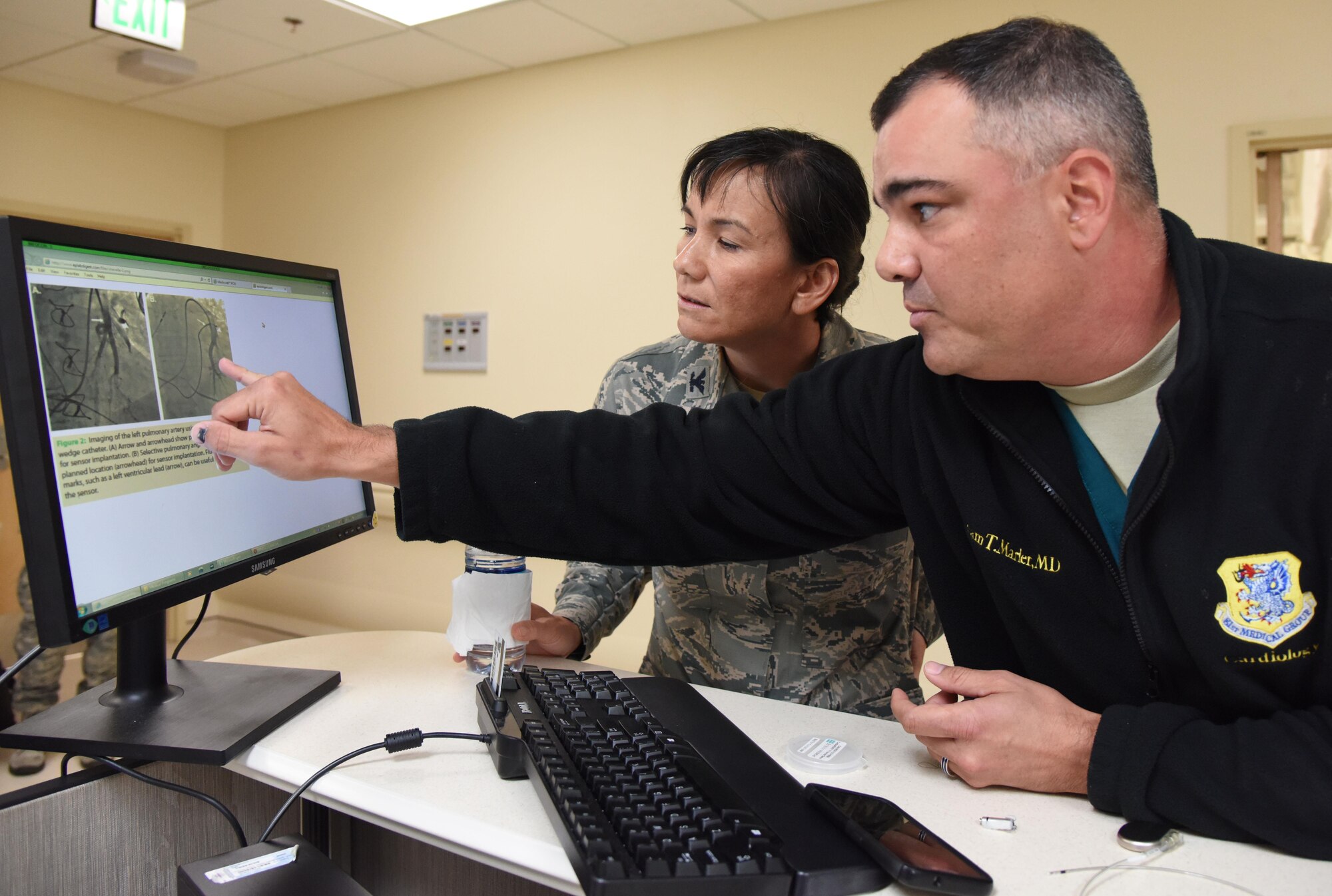 Maj. Adam Marler, 81st Medical Operations Squadron cardiologist, briefs Col. Debra Lovette, 81st Training Wing commander, on the cardiology department capabilities during an 81st Medical Group orientation tour in the Keesler Medical Center June 16, 2017, on Keesler Air Force Base, Miss. The purpose of the tour was to familiarize Lovette with the group’s mission, operations and personnel. (U.S. Air Force photo by Kemberly Groue) 