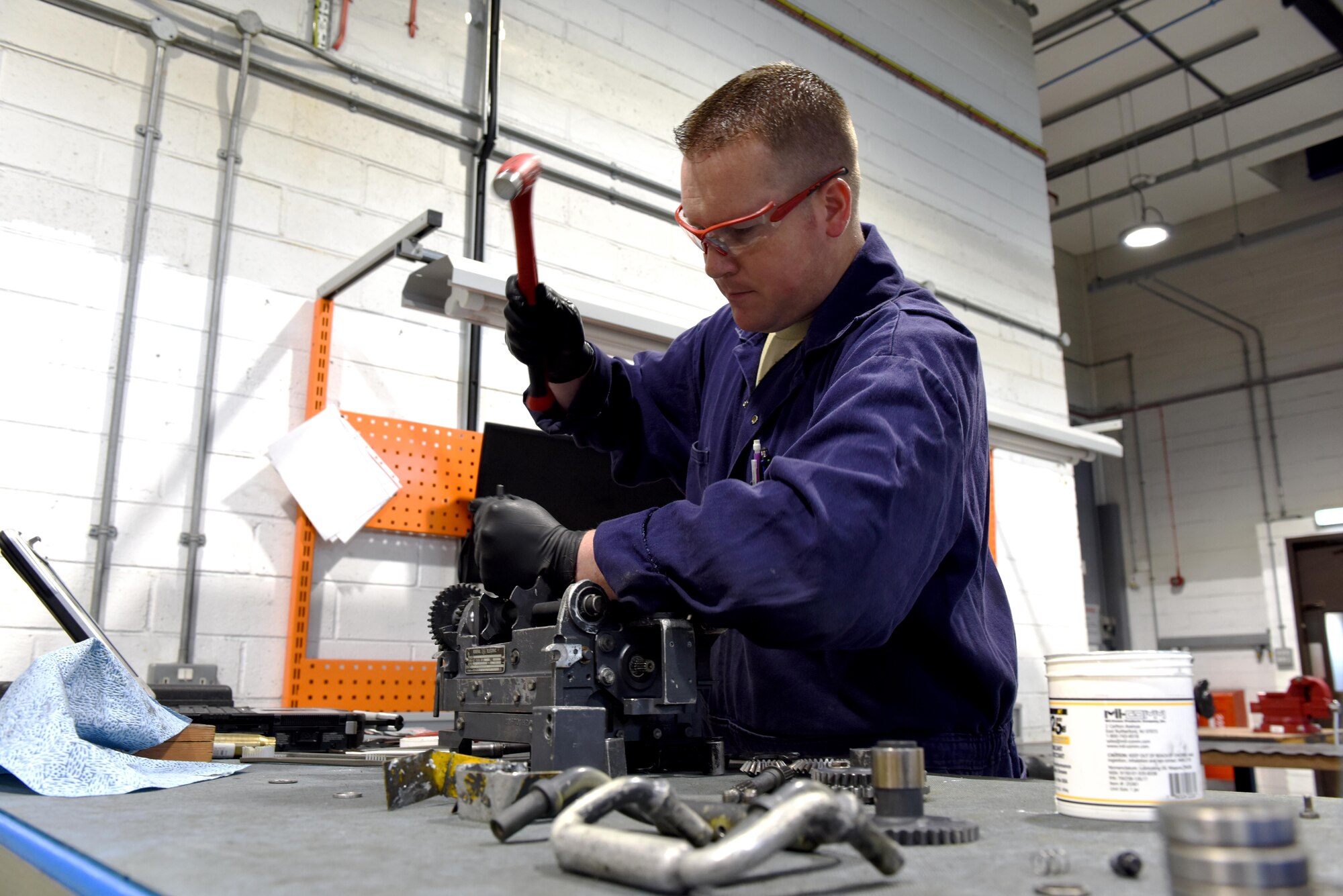 An aircraft armament specialist from the 48th Munitions Squadron preforms a rebuild of a weapons interface system at Royal Air Force Lakenheath, England, June 13. Aircraft armament specialists service aircraft gun systems. (U.S. Air Force photo/Airman 1st Class John A. Crawford)