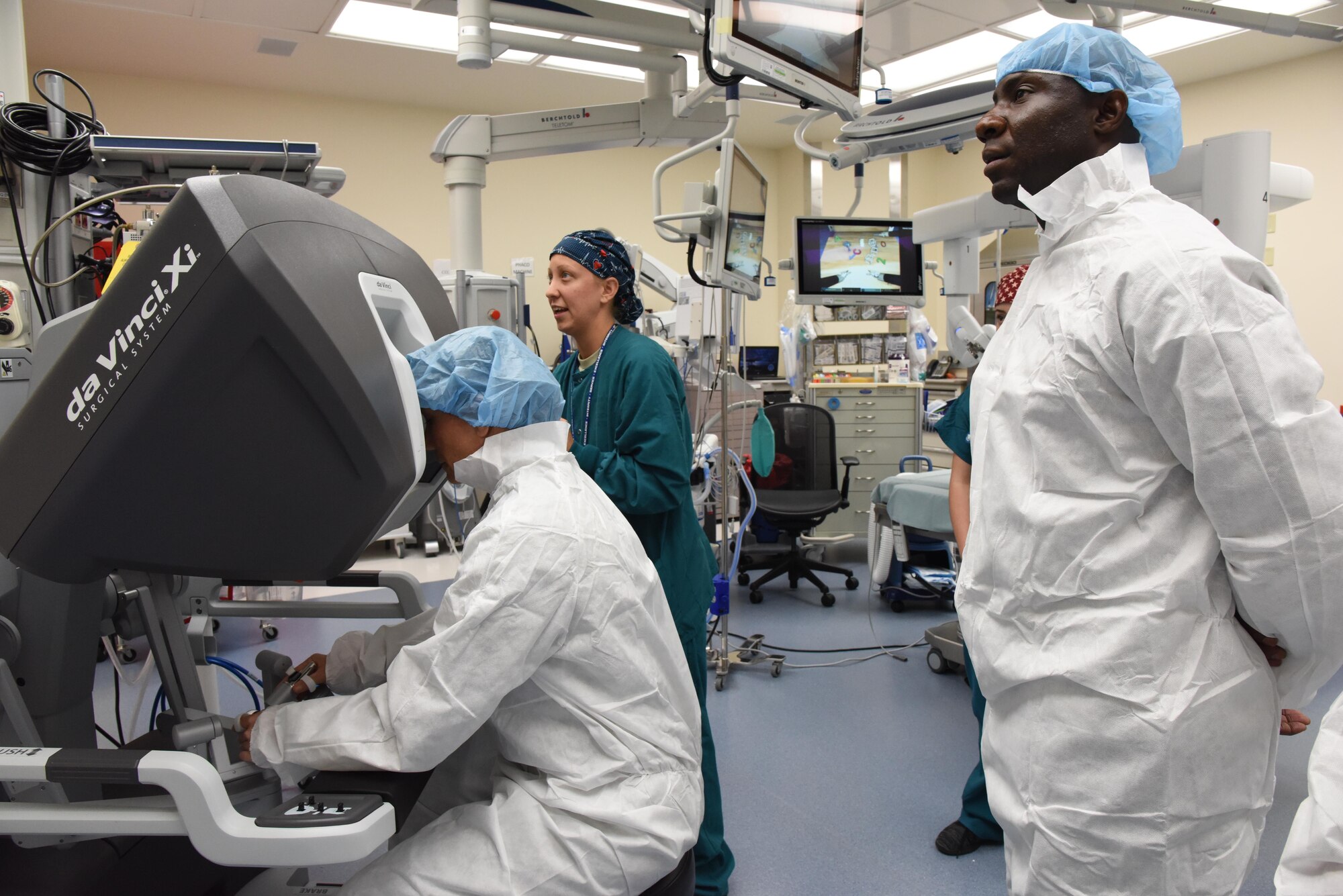 Second Lt. Nina Hoskins, 81st Surgical Operations Squadron operating room nurse, assists Col. Debra Lovette, 81st Training Wing commander, with operating a robotics surgical system inside the robotics surgery clinic during an 81st Medical Group orientation tour in the Keesler Medical Center June 16, 2017, on Keesler Air Force Base, Miss. The purpose of the tour was to familiarize Lovette with the group’s mission, operations and personnel. (U.S. Air Force photo by Kemberly Groue)