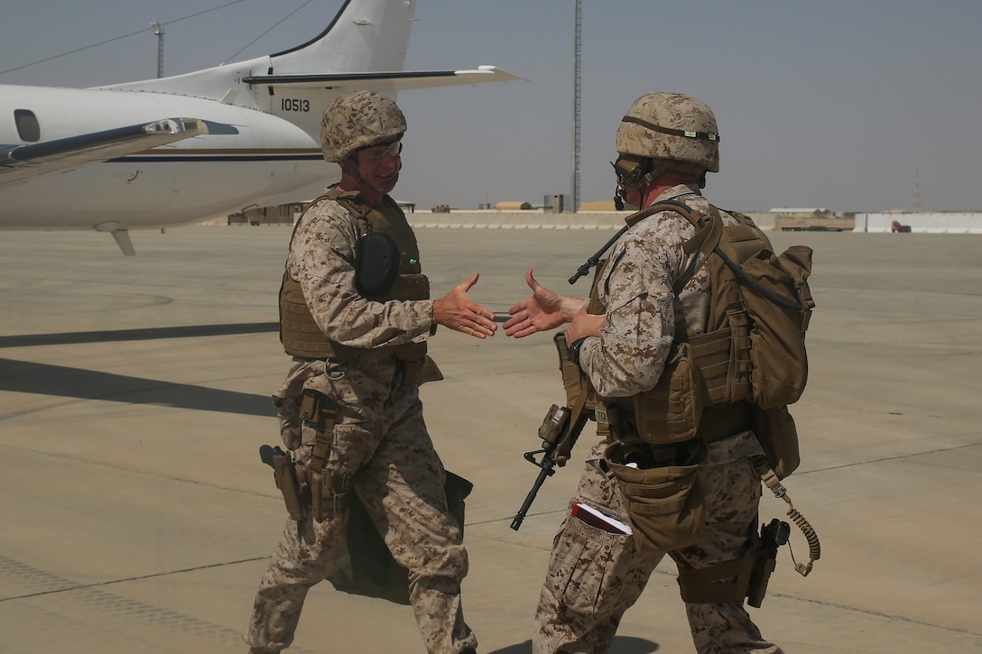 Lt. Gen. William Beydler, left, the commanding general of Marine Corps Forces Central Command, and Brig. Gen. Roger Turner, right, the commanding general of Task Force Southwest, shake hands at Bastion Airfield, Afghanistan, June 18, 2017. Beydler met with key leaders from the provincial government, 505th Zone National Police and Afghan National Army 215th Corps to discuss current events throughout Helmand Province. He also met and spoke with the Marines and Sailors of the Task Force, recognizing several Marines for their outstanding performances. (U.S. Marine Corps photo by Sgt. Lucas Hopkins)