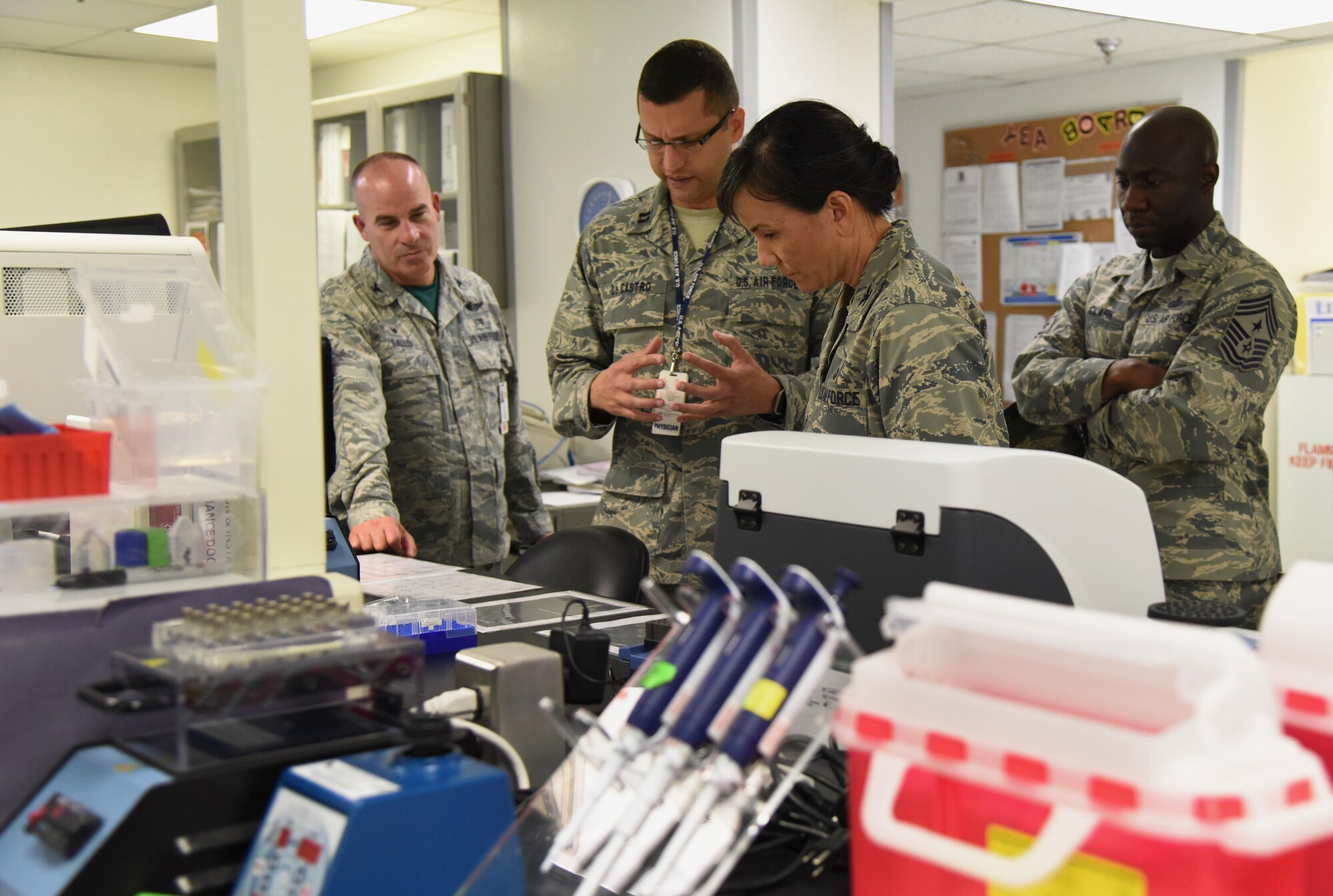 Capt. Mauricio De Castro Pretelt, 81st Medical Operations Squadron clinical and molecular geneticist, briefs Col. Debra Lovette, 81st Training Wing commander, on genetics laboratory capabilities and procedures during an 81st Medical Group orientation tour in the Keesler Medical Center June 16, 2017, on Keesler Air Force Base, Miss. The purpose of the tour was to familiarize Lovette with the group’s mission, operations and personnel. (U.S. Air Force photo by Kemberly Groue)