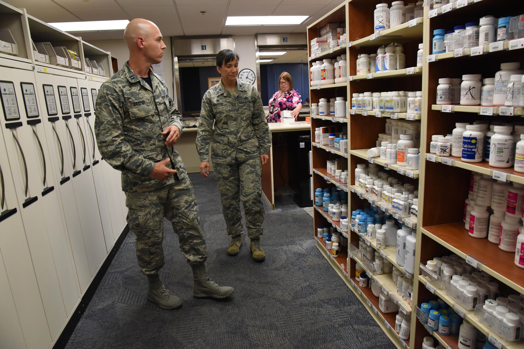 Capt. Ian Gaspar, 81st Diagnostic and Therapeutics Squadron pharmacy officer in charge, briefs Col. Debra Lovette, 81st Training Wing commander, on pharmacy capabilities and procedures during an 81st Medical Group orientation tour in the Keesler Medical Center June 16, 2017, on Keesler Air Force Base, Miss. The purpose of the tour was to familiarize Lovette with the group’s mission, operations and personnel. (U.S. Air Force photo by Kemberly Groue)