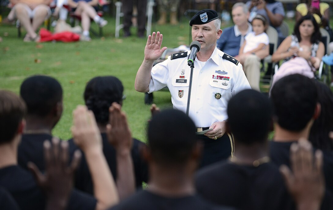 U.S. Army Maj. General Bo Dyess, Army Capabilities Integration Center commander, issues the Oath of Enlistment to 35 Army recruits during the Army 242nd Birthday Music Under the Stars concert at Joint Base Langley-Eustis, Va., June 15, 2017. The evening’s events, which included a streamer ceremony and a Music Under the Stars performance by the U.S. Army Training and Doctrine Command Band, brought a close to the birthday week celebrations. (U.S. Air Force photo/Staff Sgt. Teresa J. Cleveland)