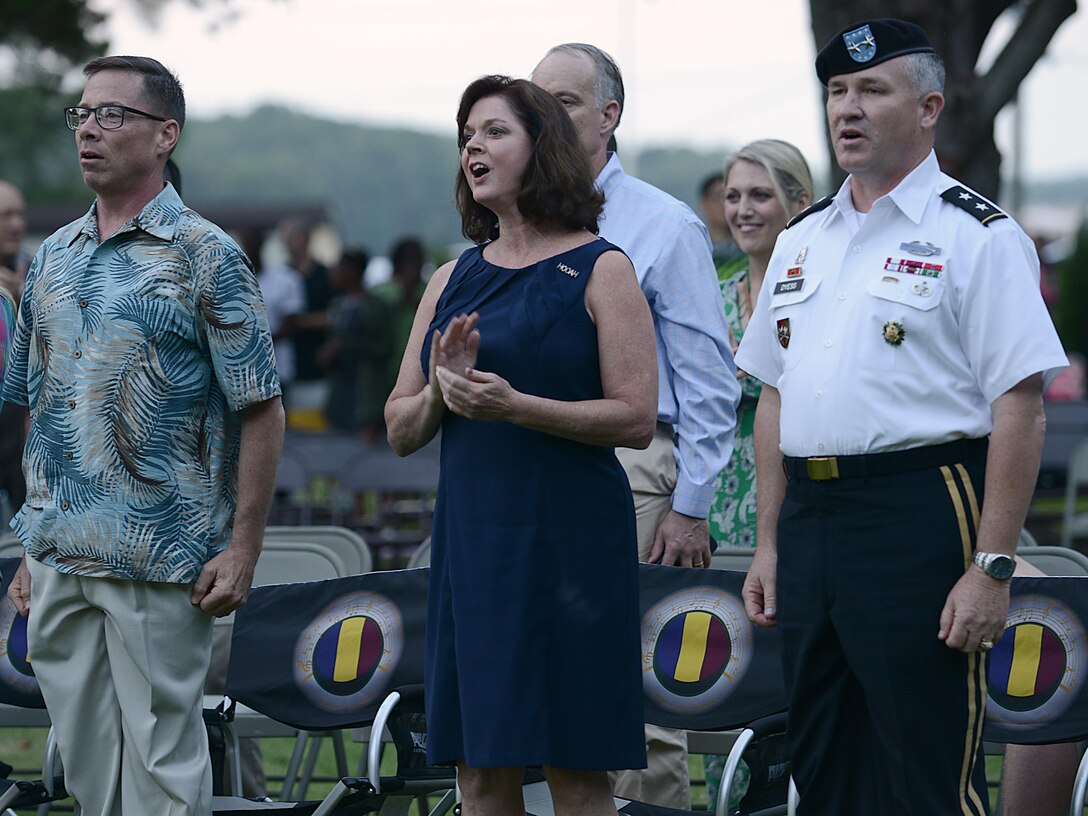 U.S. Army Maj. General Bo Dyess, Army Capabilities Integration Center commander, his wife Sharon Dyess and friends sing the Army Song during the Army 242nd birthday, Music Under the Stars celebration at Joint Base Langley-Eustis, Va., June 15, 2017. During the event, spectators were asked to sing and show support as each service’s song was played. (U.S. Air Force photo/Staff Sgt. Teresa J. Cleveland)