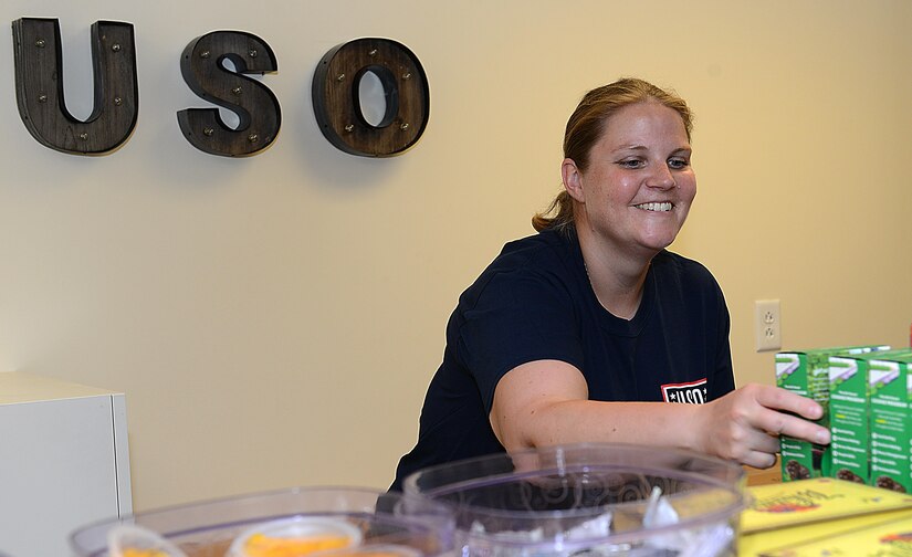 Kylie Wathen, a USO volunteer, restocks snacks at a USO center at Joint Base Langley-Eustis, Va., June 19, 2017. Wathen has volunteered regularly at both JBLE USO locations to provide a welcoming environment for U.S. service members of all branches of service. (U.S. Air Force photo/Staff Sgt. Teresa J. Cleveland)