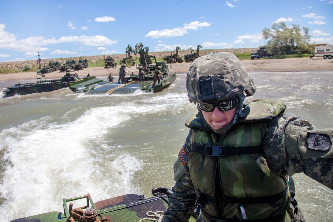 South Dakota Army National Guardsmen remove an Improved Ribbon Bridge from the water during exercise Golden Coyote in Orman, S.D., June 14, 2017. Army photo by Spc. Jeffery Harris