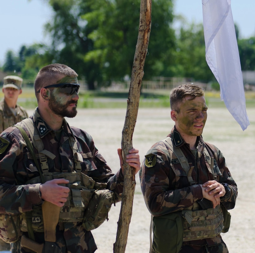 Hungarian soldiers stand in formation with U.S. soldiers assigned to Apache Troop, 4th Squadron, 10th Cavalry Regiment, during a spur ceremony in Tata, Hungary, June 1, 2017. Army photo by Capt. John W. Strickland