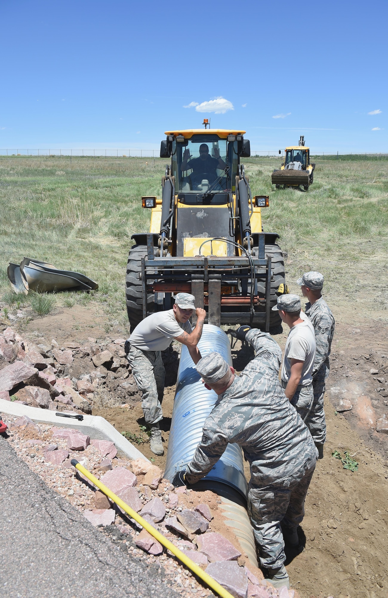 50th Civil Engineer Squadron members and 446th Civil Engineer Squadron reservists from Joint Base Lewis-McChord, Washington, install pipes at Schriever Air Force Base, Colorado Thursday, June 15, 2017. For 446 CES Airmen this has been an opportunity to become more proficient in their job and have diverse training opportunities. (U.S. Air Force photo/Senior Airman Arielle Vasquez)