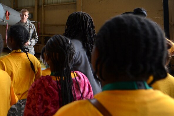 A U.S. Air Force Airman assigned to the 20th Fighter Wing talks with adolescents attending the Sumter County Sheriff’s Office’s annual youth conference about the F-16CM Fighting Falcon at Shaw Air Force Base, S.C., June 16, 2017. During the visit, attendees had the opportunity to get a close-up look at aircraft and equipment displays. (U.S. Air Force photo by Airman 1st Class Christopher Maldonado)