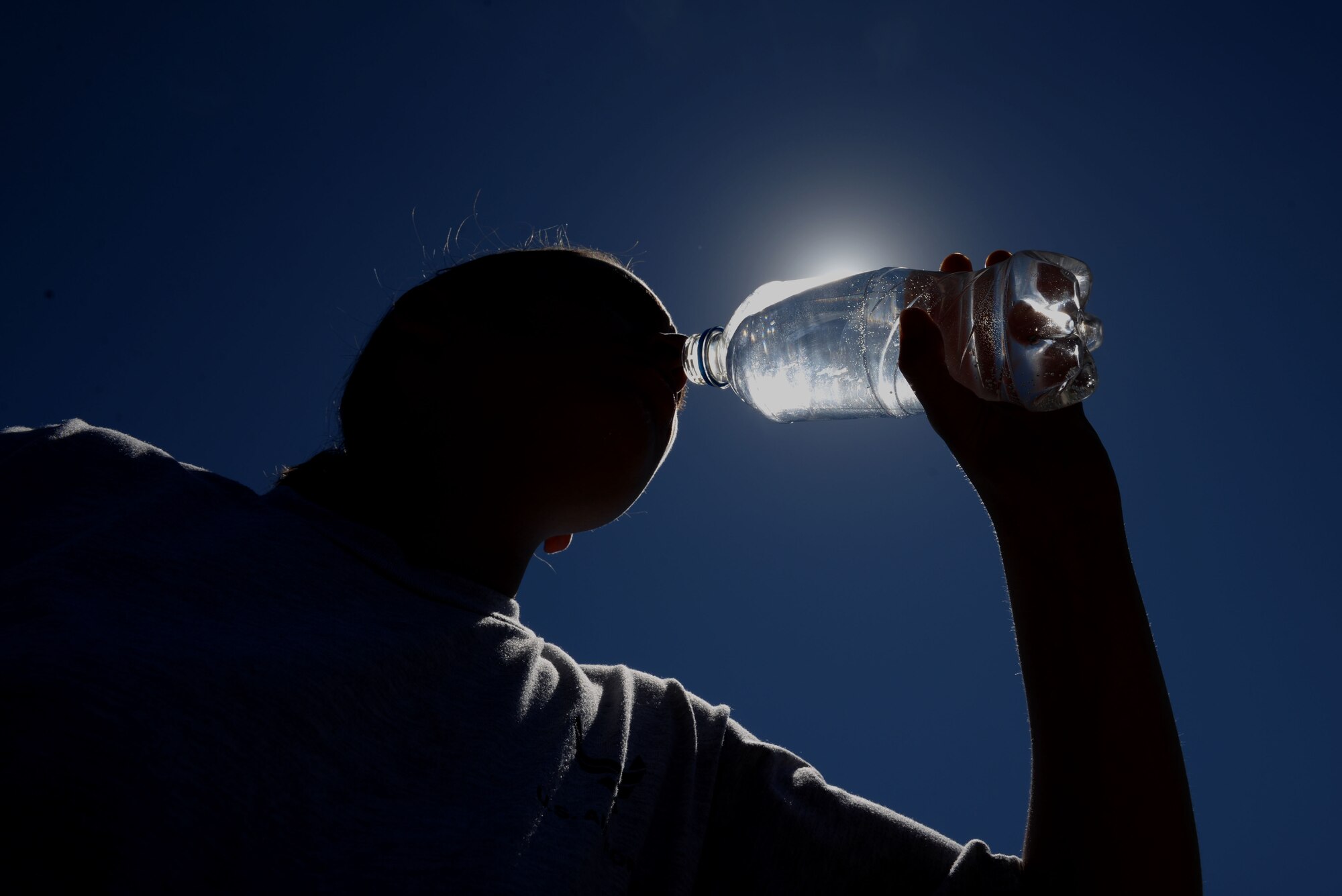 Drink water the day before and during physical activity or if heat is going to become a factor. Avoid drinks with caffeine or alcohol, especially before strenuous exercise. (U.S. Air Force photo by Airman Rhett Isbell)