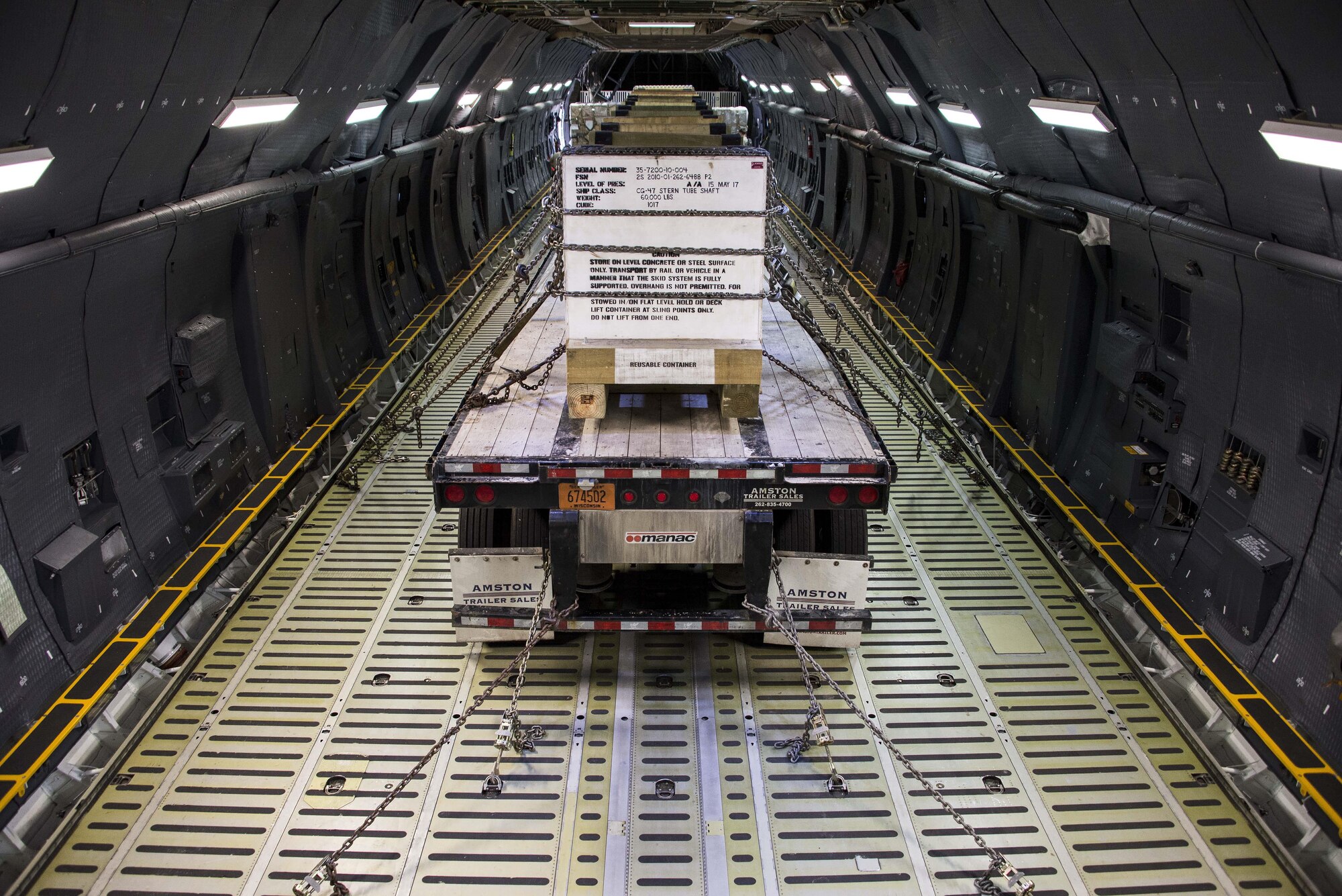 A U.S. Navy propulsion shaft is secured for transportation to the Pacific theater in a C-5M Super Galaxy at Travis Air Force Base, Calif., June 9, 2017.  As the largest aircraft in the U.S. Air Force’s inventory, the C-5M Super Galaxy serves as mobility air forces primary strategic airlift platform for transporting oversized and unconventional cargo. (U.S. Air Force photo by Staff Sgt. Charles Rivezzo)  