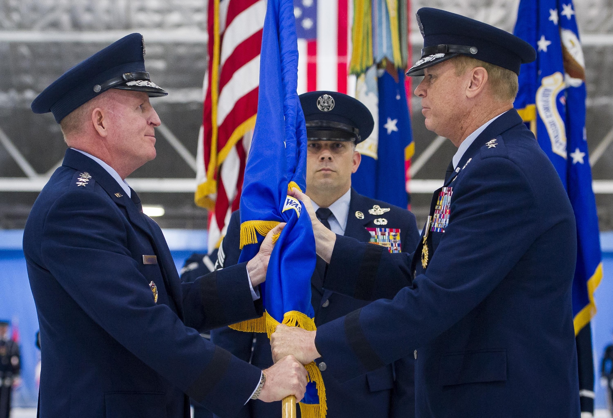 Maj. Gen. Darryl Burke (right) relinquishes  command of the Air Force District of Washington during a ceremony on Joint Base Andrews, Md. June 20, 2017. Air Force Vice Chief of Staff Gen. Stephen Wilson (left) presided over the ceremony where Burke relinquished command to Maj. Gen. James Jacobson. (U.S. Air Force photo/Jim Varhegyi)(released)