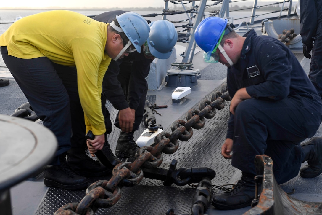 Sailors place a chain stopper on the anchor chain during an anchor drop test aboard the guided missile destroyer USS Wayne E. Meyer in the Western Pacific Ocean, June 11, 2017. Navy photo by Petty Officer 3rd Class Kelsey L. Adams