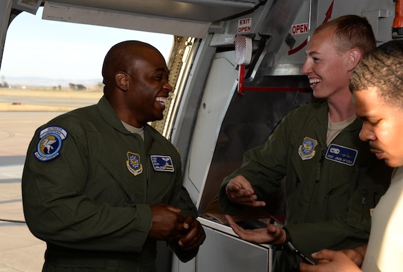 Tech. Sgt. Kenneth Cook (Left), 6th Air Refueling Squadron, shares a laugh with Staff Sgt. Jack McCoy, 660th Aircraft Maintenance Squadron, inside a KC-10 Extender prior to loading operations at Travis Air Force Base, Calif., June 17, 2017. Cook oversaw the loading of more than 15,000 pounds of cargo prior to a flight to Joint Base Pearl Harbor-Hickam, Hawaii. (U.S. Air Force photo by Tech. Sgt. James Hodgman)