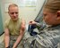 Staff Segeant Chelsea Robinson, Allergy/Immunization technician administers an inoculation to Staff Sergeant Cody Polen, immunization backup technicion at the Wright-Patterson Air Force Base Hospital Immunization/Allergy Clinic June 8, 2017. The clinic administers a large variety of vaccinations from anthrax to yellow fever to all authorized beneficiaries. (U.S. Air Force photo/Al Bright/Released)