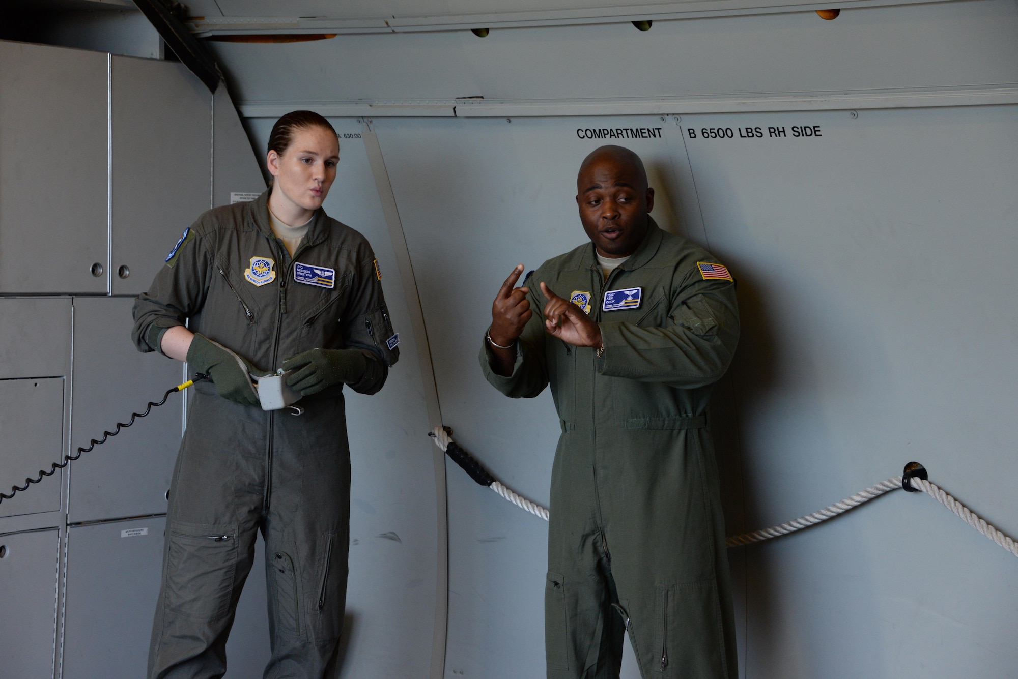 Airman 1st Class Neesen Bristow (Left), 6th Air Refueling Squadron, listens to Tech. Sgt. Kenneth Cook (Right), 6th ARS, provide instruction on KC-10 Extender loading operations at Travis Air Force Base, Calif., June 17, 2017. Cook oversaw the loading of more than 15,000 pounds of cargo prior to a flight to Joint Base Pearl Harbor-Hickam, Hawaii. (U.S. Air Force photo by Tech. Sgt. James Hodgman)
