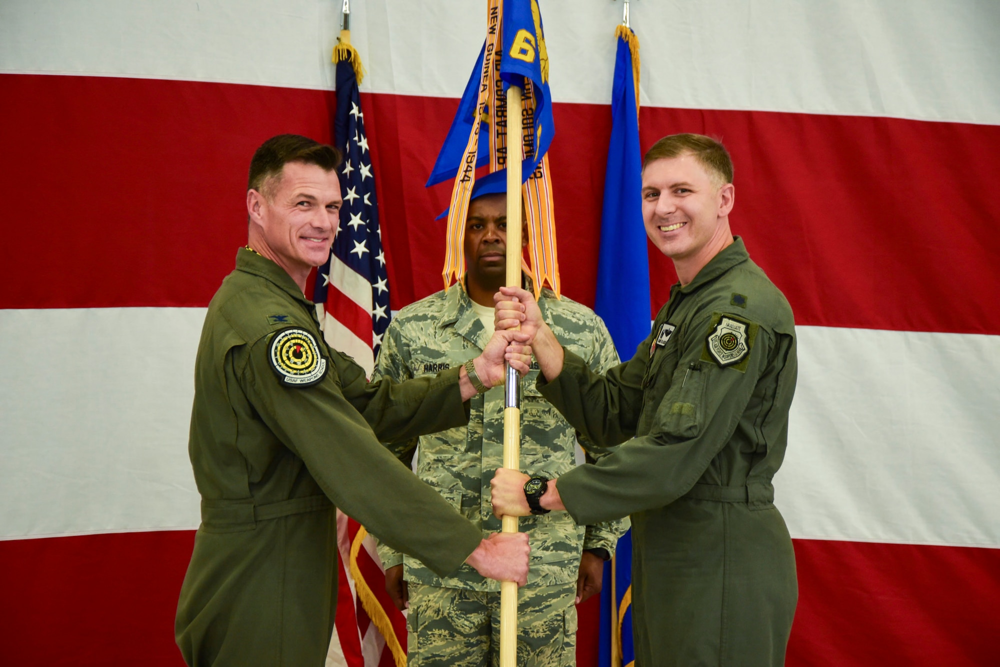 Lt. Col. Michael Blauser, 6th Weapons Squadron commander, assumes command of the squadron from Col. Michael Drowley, US Air Force Weapons School commandant, June 20, 2017, at Nellis Air Force Base, Nev. The 6th WPS was inactivated more than 70 years ago due to force-wide budget cuts. (U.S. Air Force photo by Airman 1st Class Andrew D. Sarver/Released)