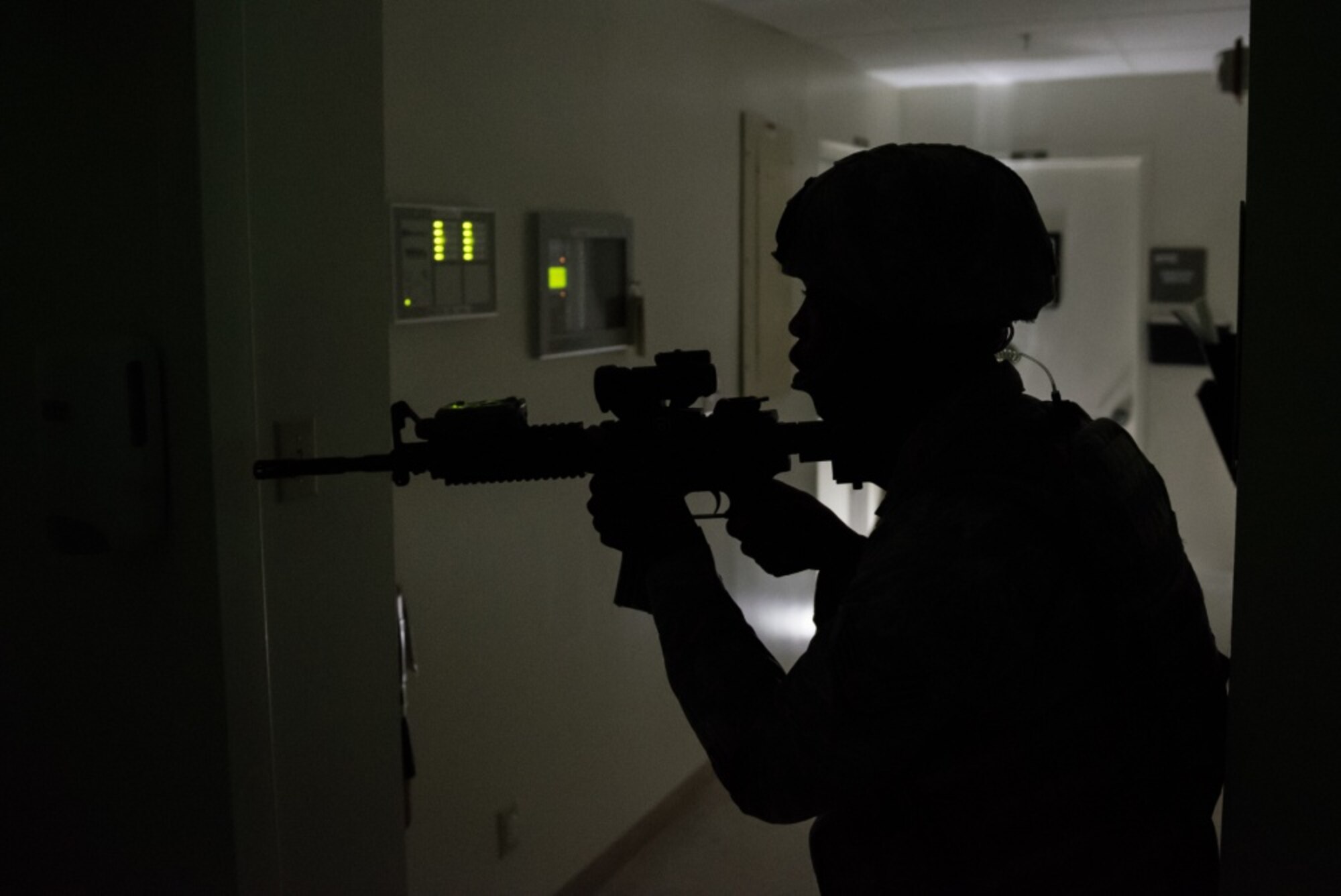U.S. Air Force Staff Sgt. Gene McLaurin, 36th Security Forces Squadron, searches for additional threats after an active shooter was neutralized during an emergency management exercise May 11, 2017, at Andersen Air Force Base, Guam. When known active shooters are no longer a threat, SFS Airmen clear the building to ensure the area is safe. (U.S. Air Force photo by Airman 1st Class Jacob Skovo)
