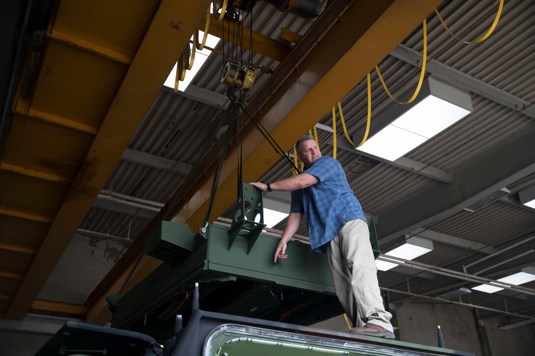 James Goodwin, instructor for the MK-154 Launcher Mine Clearance kit course, prepares a MK-154 LCM to be installed onto an assault amphibious vehicle on Camp Pendleton, Calif., June 19, 2017. The MK-154 LMC is being reintroduced to the fleet after safety issues halted its employment in 2013. The system is the only amphibious breaching capability within the Department of Defense, allowing the forces assault mined areas. (U. S. Marine Corps photo by Lance Cpl. Maritza Vela)