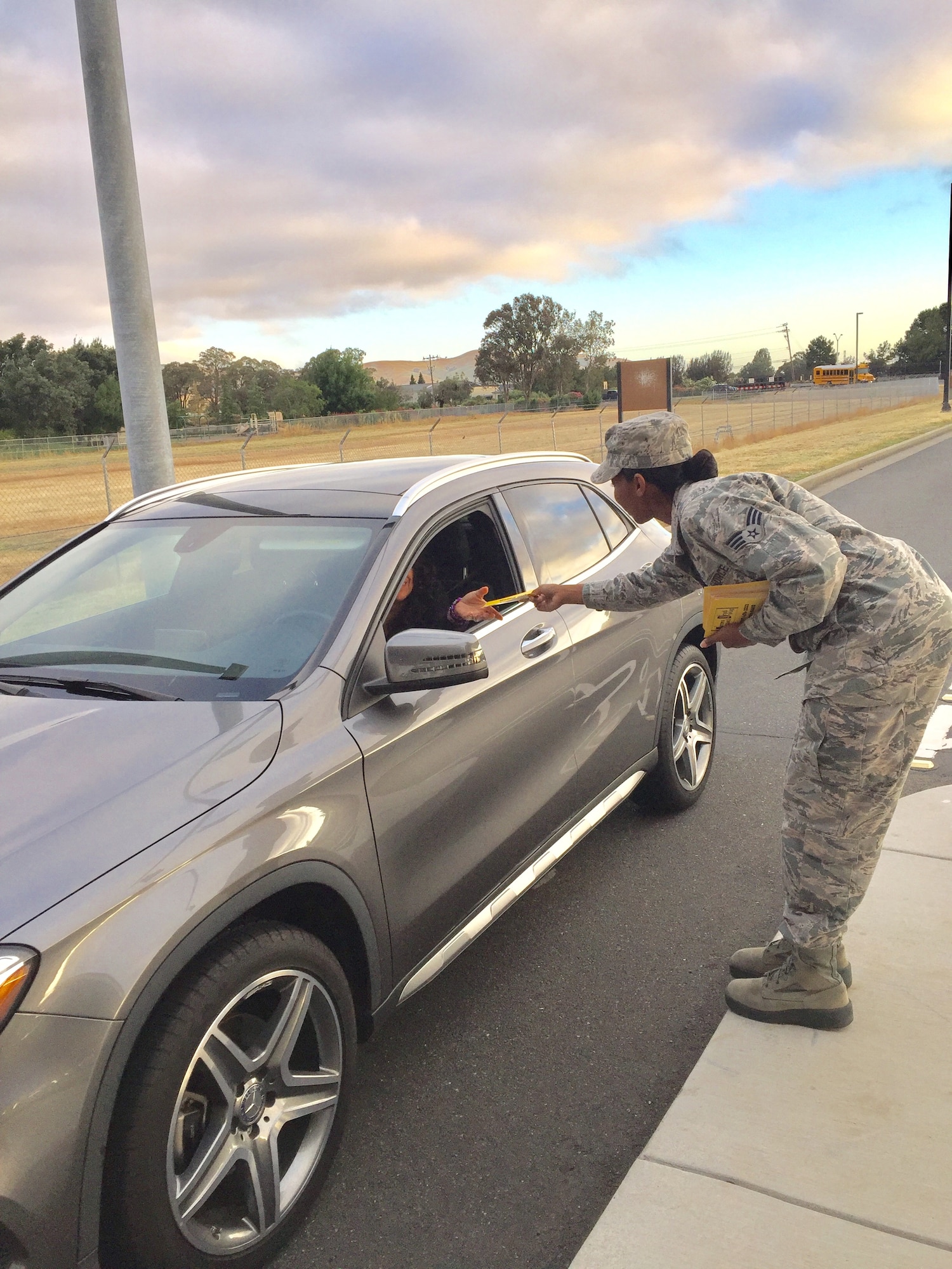 Volunteers from Airmen Against Drunk Driving and the DUI task force hand each individual who enters base a flyer reminding him or her to drive safely May 26 at Travis Air Force Base, Calif. When the spring and early summer months saw an uptick in driving under the influence reports at Travis, a DUI task force comprised of Airmen and civilians from a variety of squadrons implemented innovative ideas on how to effectively address the problem of DUIs. (Courtesy Photo)