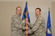U.S. Air Force Lt. Col. Benjamin Clarke, 20th Dental Squadron (DS) commander, receives the 20th DS guidon from Col. Brian Wyrick, 20th Medical Group commander, during a change of command ceremony at Shaw Air Force Base, S.C., June 6, 2017. The squadron is responsible for providing comprehensive oral care for the base’s active-duty members ensuring they are healthy to deploy. (U.S. Air Force photo by Airman 1st Class Kathryn R.C. Reaves)