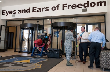 Senior Airman Aliyah (left), 9th Intelligence Squadron imagery analyst, receives instruction from Josh Wren, Booz Allen Hamilton instructional systems designer, on how to use a virtual reality headset at Beale Air Force Base, Calif., May 24, 2017. Virtual reality technology is also utilized by the Air Force to help hone pilots' flying skills in a safe environment. (U.S. Air Force photo by Senior Airman Lauren Parsons/Released)