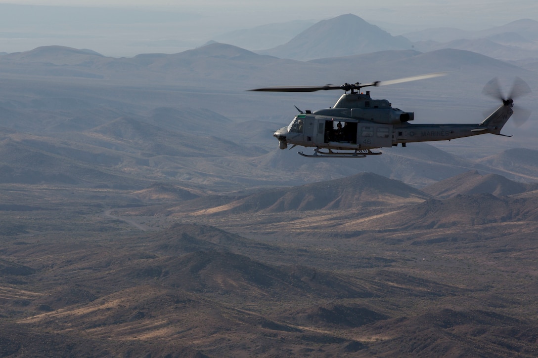 U.S. Marine Corps Col. Thomas E. Prentice, commanding officer, 23rd Marine Regiment, 4th Marine Division, Marine Forces Reserve, conduct reconnaissance of the training area at Marine Air Ground Combat Center Twentynine Palms, California during Integrated Training Exercise 4-17 on a UH-1Y Huey belonging to Marine Light Attack Helicopter Squadron 773, Marine Aircraft Group 49, 4th Marine Aircraft Wing, MARFORRES, June 20, 2017. The scouting mission was in preparation of the 25th Marine Regiment final battalion exercise during ITX 4-17.
