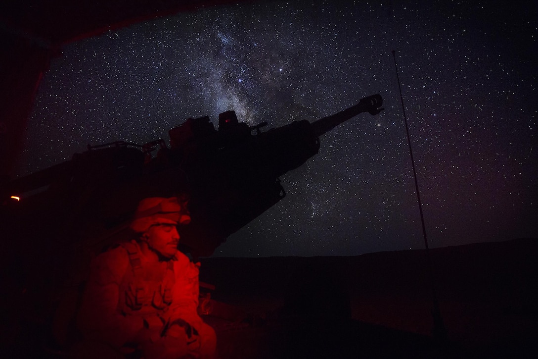 A U.S. Marine waits to conduct a fire mission in the early morning in Syria, June 3, 2017. The Marines have been conducting 24-hour all-weather fire support for the Coalition’s local partners, the Syrian Democratic Forces, as part of Combined Joint Task Force-Operation Inherent Resolve. CJTF-OIR is the global coalition to defeat ISIS in Iraq and Syria.