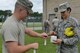 U.S. Air Force Senior Airman Justin Eason, 20th Civil Engineer Squadron readiness and emergency management journeyman, left, and Senior Airman Carola Anselmi, 20th Aerospace Medicine Squadron bioenvironmental journeyman, put tape onto a soil sample container during a joint quarterly chemical, biological, radiological and nuclear exercise at Shaw Air Force Base, S.C., June 21, 2017. The Airmen used tape to prevent any simulated hazards from escaping the container during the exercise, which maintain their flights’ readiness to respond to various emergencies, such as aircraft mishaps and hazardous material spills. (U.S. Air Force photo by Airman 1st Class Destinee Sweeney)