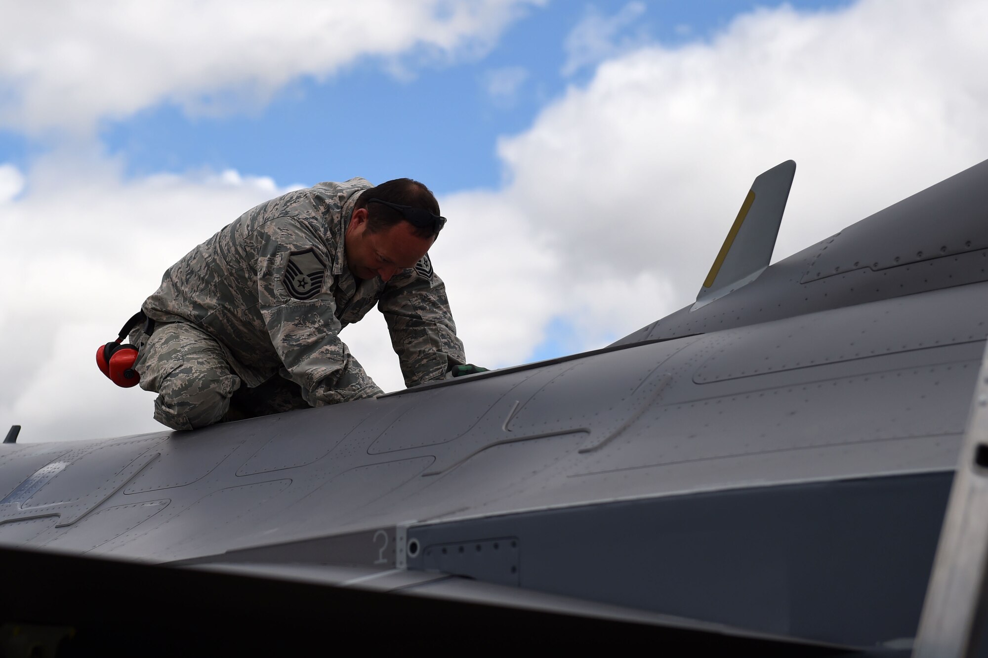 Master Sgt. Dave Bingham, 132d Wing transient alert and fuels, performs maintenance on an F-16C Fighting Falcon aircraft on May 24, 2017, at the 114th Fighter Wing, Sioux Falls, South Dakota. The 132d Wing transient alert volunteers performed training with the South Dakota Air National Guard to remain qualified. (U.S. Air National Guard photo by Senior Master Sgt. Robert P. Shepherd)