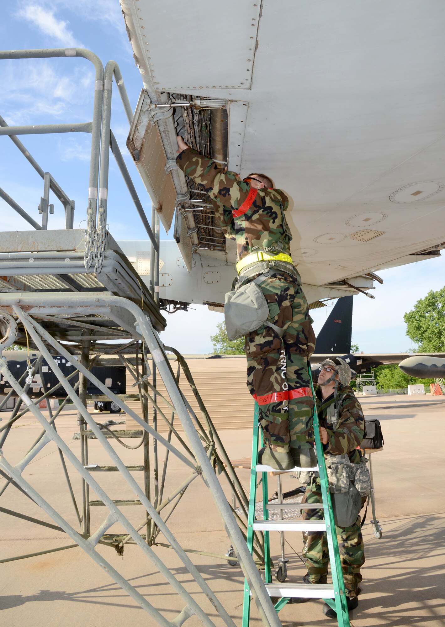 Tech. Sgt. Sascha Newberry, on ladder, and Tech. Sgt. Jesse Rikard, both with the 76th Aircraft Maintenance Group’s Expeditionary Depot Maintenance Flight, inspect damage on the wing of a KC-135 during a recent war wagon exercise. EDMX provides a unique capability to air logistics complexes. Consisting of 25 personnel from two AFSC’s, EDMX is the sole source provider of Aircraft Battle Damage Repair for the Air Force, providing support to B-1, B-52, E-3 and KC-135 aircraft across the globe. (Air Force photo by Kelly White)