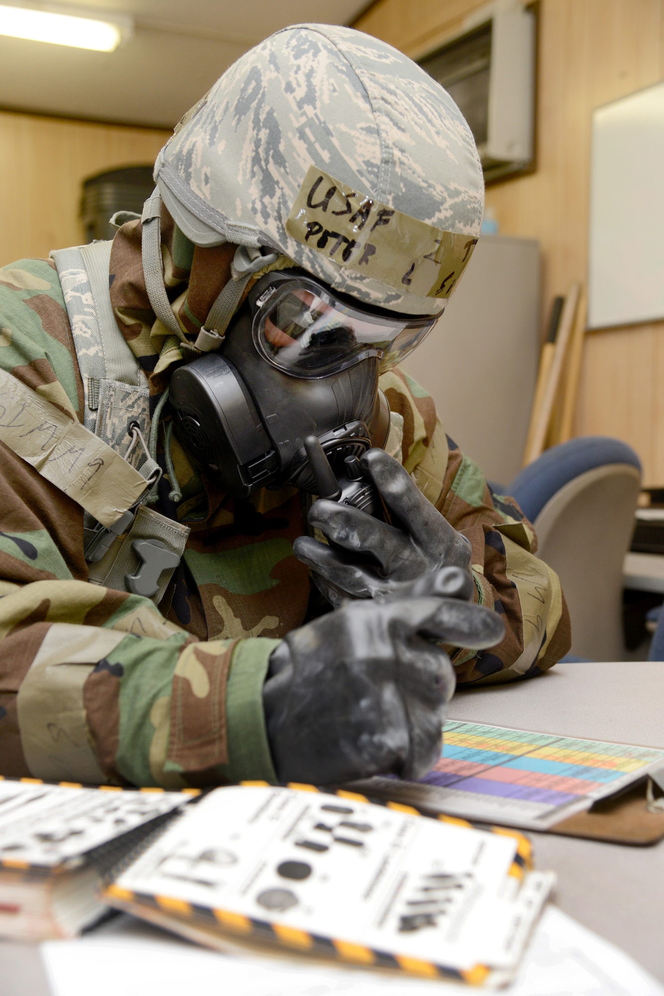 Tech. Sgt. Peter Silcox calls the command post during a recent war wagon exercise to report unexploded ordnances casualties and other incident issues. (Air Force photo by Kelly White)