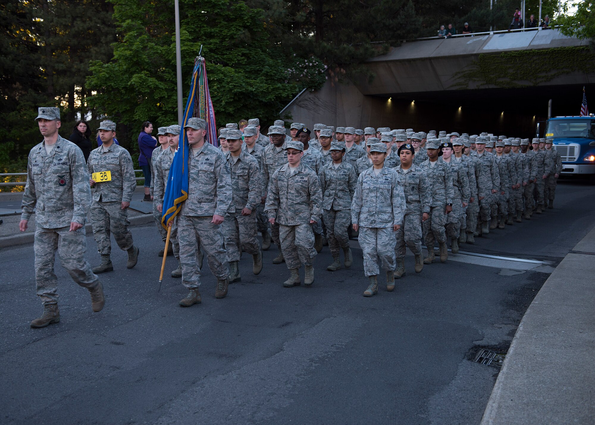 Lt. Col. Ross Gleason, 92nd Civil Engineering Squadron commander, leads a flight of Airmen from Fairchild Air Force Base as they march in the annual Lilac Festival Armed Forces Torchlight Parade May 20, 2017, Spokane, Washington. The local gardening clubs that originally created the Lilac Festival were also known to have shown military support by giving lilacs to soldiers passing through Spokane on troop trains during World War 2.
(U.S. Air Force photo / Airman 1st Class Ryan Lackey)
