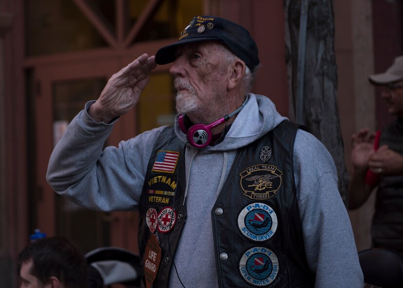 A veteran gives a salute to passing Fairchild Air Force Base Airmen during the annual Lilac Festival Armed Forces Torchlight Parade May 20, 2017, Spokane, Washington. The Lilac Festival began as a local gardening club that held annual flower shows, later merging the event with the Armed Forces day in 1949.
(U.S. Air Force photo / Airman 1st Class Ryan Lackey)