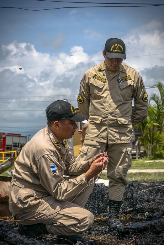 The Siguatepeque and Comayagua Fire Department train with the 612th Air Base Squadron on fire inspecting. The 612th ABS Fire Department host a public fire training at Soto Cano Air Base, June 16, 2017. (U.S. Air Force photo by Senior Airman Julie Kae/released)