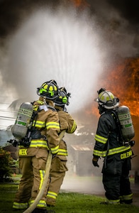 The 612th Air Base Squadron Firefighters control the smoke and fire. The 612th ABS Fire Department host a public fire training at Soto Cano Air Base, June 16, 2017. (U.S. Air Force photo by Senior Airman Julie Kae/released)