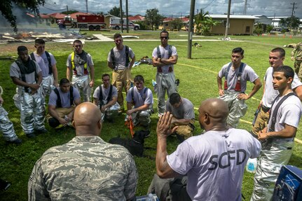 Master Sgt. Corey T. Coleman gives a debrief after the exercise. The 612th Air Base Squadron Fire Department host a public fire training at Soto Cano Air Base, June 16, 2017. 