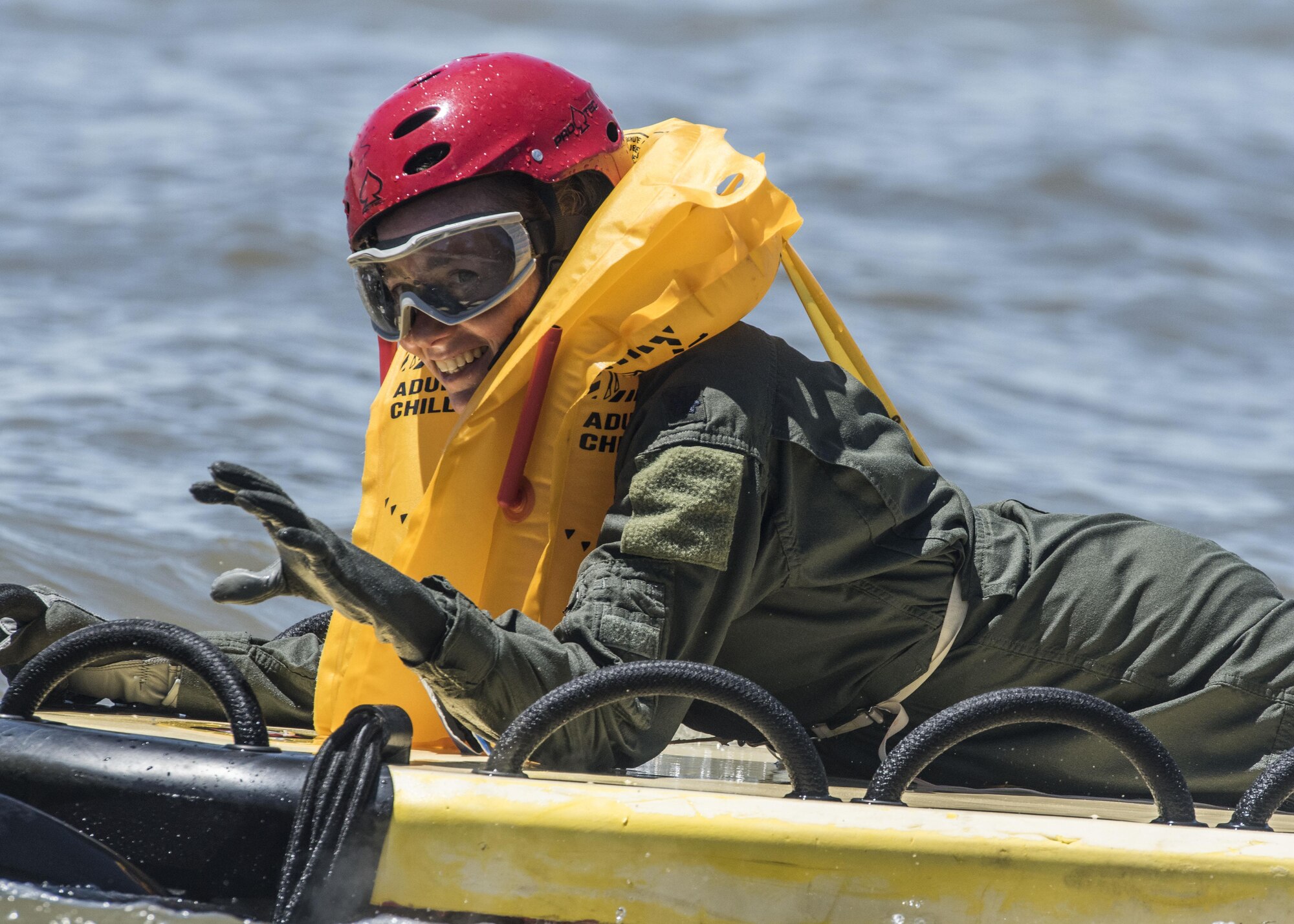 Lt. Col. Brooke Matson, 375th Operations Support Squadron from Scott Air Force Base,  prepare for their her ever medical evacuation water extraction with the 6-101st Aviation Regiment from Fort Campell, Kentucky at Lake Carlyle, Illinois, June 7, 2017. Matson, Lt. Col. Brandon Dow, 54th Airlift Squadron and Maj. Madison Basil Jr., Air Mobility Command, received hoist, water survival and flare training to learn how to survive in aqautic situations long enough to be rescued. The 101st Combat Aviation Brigade has served in almost every single military operation since the Vietnam War, including combat, peacekeeping, and humanitarian. By partnering with AMC's SERE instructors, this training allows for joint-service coordination while preparing aerial crew members to survive in austere locations ater being displaced from their aircraft. (U.S.Air Force photo by Airman 1st Class Daniel Garcia)