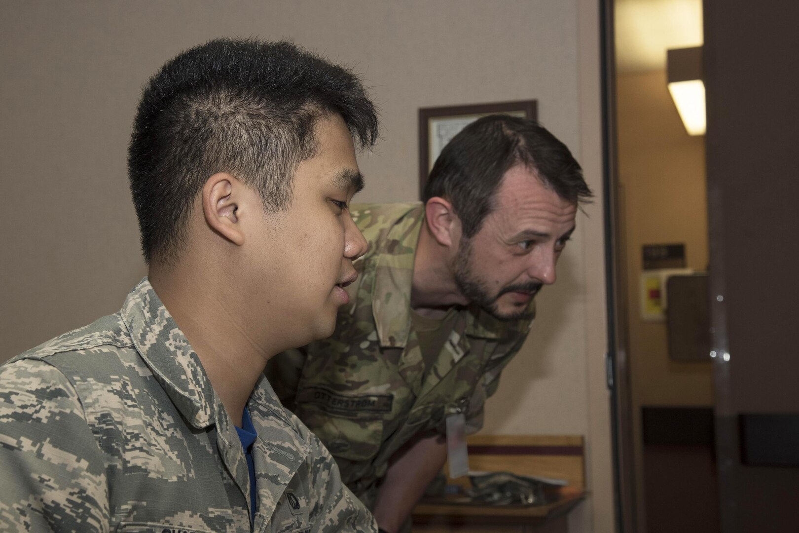 U.S. Air Force Airman 1st Class Anthony Ohara, a 35th Operations Support Squadron weather forecaster, briefs Royal Danish Army Capt. Andreas Otterstoem, a 116th Air Support Operations Squadron joint terminal attack controller, on the weather forecast for the day during RED FLAG-Alaska 17-2, at Eielson Air Force Base, Alaska, June 16, 2017. Along with the Republic of Korea, Misawa's weather Airmen briefed other nations including the Royal Thai Air Force and the Japan Air Self-Defense Force.
