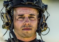 Goggle imprints circle the eyes of a Scott Air Force Base SERE instructor during the first-ever medical evacuation water extraction with the 6-101st Aviation Regiment from Fort Campbell, Ky. at Lake Carlyle, Ill., June 7, 2017. Lt. Col. Brooke Matson, 375th Operations Support Squadron, Lt. Col. Brandon Dow, 54th Airlift Squadron, and Maj. Madison Basil Jr., Headquarters Air Mobility Command, received hoist, water survival, and flare training to learn how to survive in aquatic situations long enough to be rescued. The 101st Combat Aviation Brigade has served in almost every single military operation since the Vietnam War, including combat, peacekeeping, and humanitarian.  By partnering with Air Mobility Command’s SERE instructors, this training allows for joint-service coordination while preparing aerial crew members to survive in austere locations after being displaced from their aircraft.  (U.S. Air Force photo by Staff Sgt. Jodi Martinez)