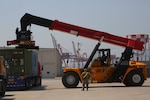 551st Inland Cargo Transfer Company soldiers download cargo containers as part of a combined reception, staging and onward movement operations exercise at the Busan Storage Center, June 14, 2017. The containers were later loaded onto vehicles for transportation to their final destination as part of the joint training.