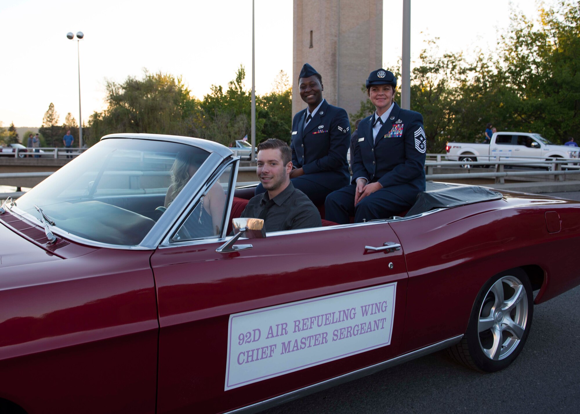 Chief Master Sgt. Shannon Rix, 92nd Air Refueling Wing command chief master sergeant, rides with Airman 1st Class Mary Dunkley, 92nd Maintenance Squadron fuels technician, as part of the Air Force procession during the annual Lilac Festival Armed Forces Parade May 20, 2107, Spokane Washington. A Fairchild Air Force Base KC-135 Stratotanker flew over downtown Spokane as a signal to start the parade. 
(U.S. Air Force photo / Airman 1st Class Ryan Lackey)